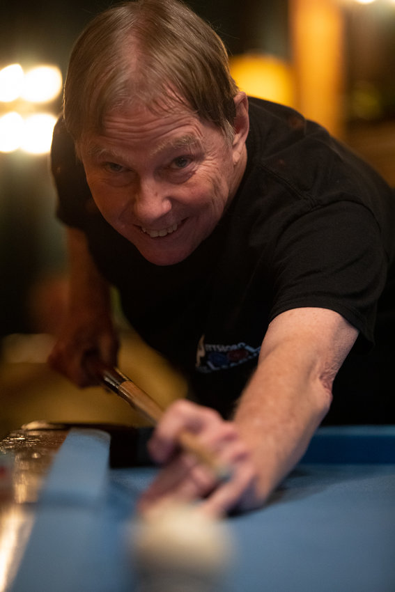 Jay Niver, founder of the Pittsboro Pool League, shoots the ball during a match at The Sycamore at Chatham Mills on Wednesday, Nov. 2, 2022. Niver won the match.