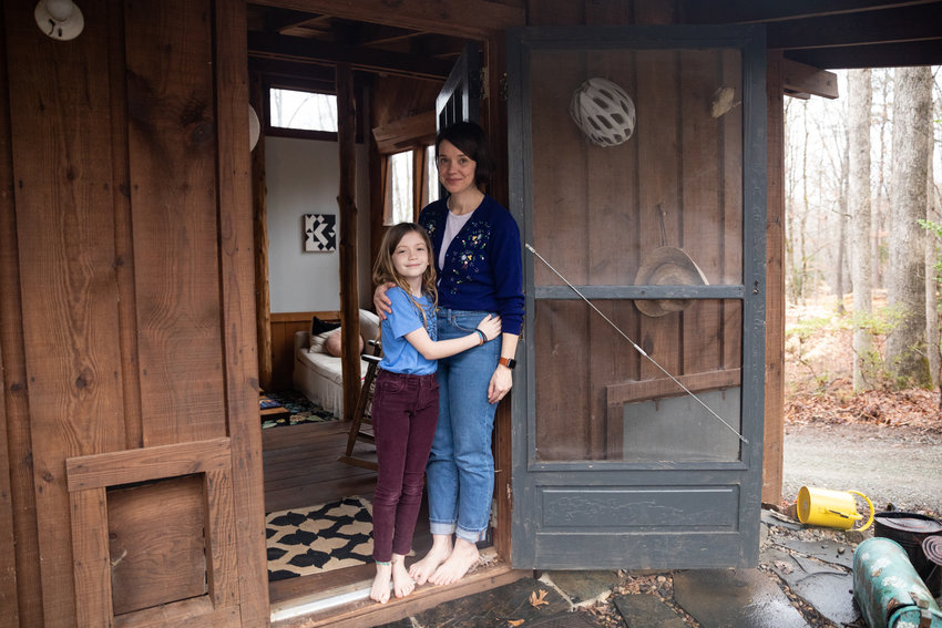 Bea Allen, 9, poses for a portrait with her mom, Belle Boggs, at their home. The two run a blog together on Substack called 'Frog Trouble Times.'