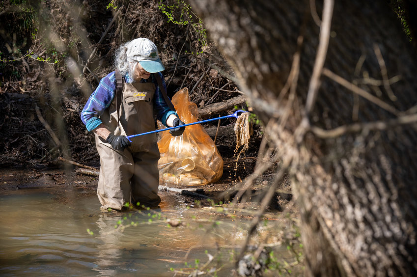 Once Diana Montgomery saw the amount of trash in Loves Creek, it was difficult to get her to stop at Saturday's cleanup event.