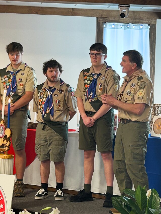 From left, Eagle Scouts Mason Powell, Seph Trageser, and Zack Wilson, with Troop 93 High Adventure Coordinator Randall Goodman