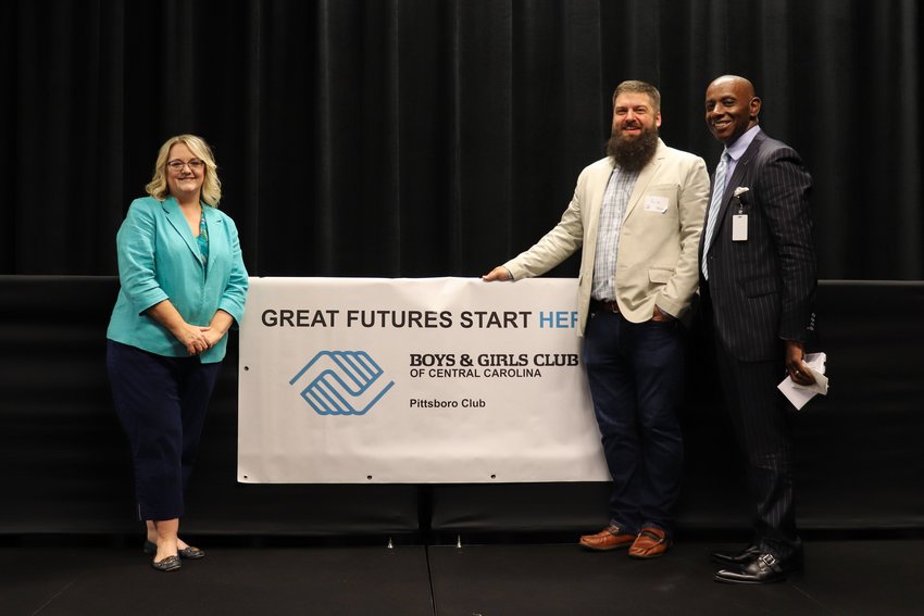 Dr. Amanda Hartness of Chatham County Schools (from left), Pittsboro Commissioner Kyle Shipp and Dr. Anthony Jackson, superintendent of Chatham County Schools, pose after last Wednesday&rsquo;s fundraising breakfast for the Boys &amp; Girls Club of Pittsboro. Shipp helped spearhead efforts to start the club; Jackson served as the event&rsquo;s keynote speaker.