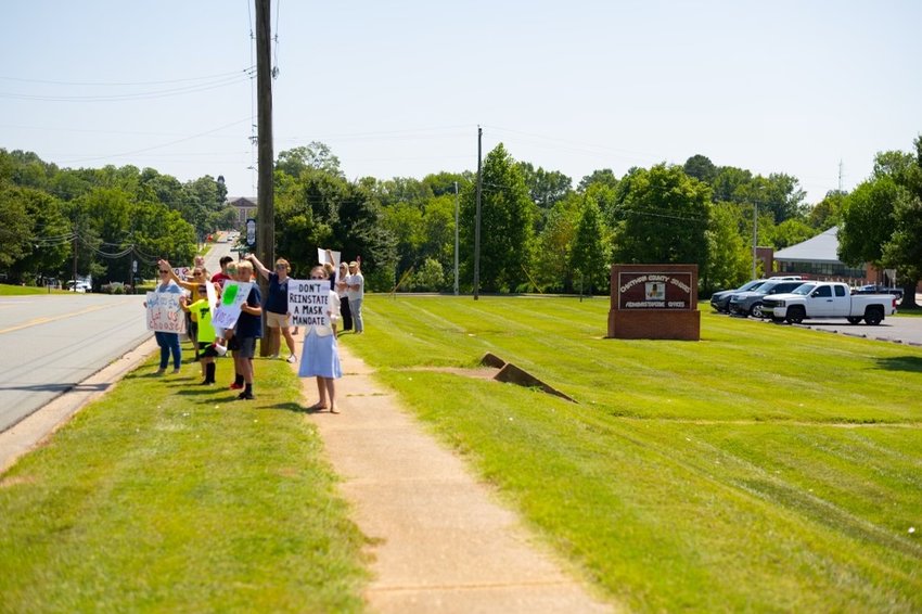 Parents gathered at a &quot;Parent's Choice 4 Masks Rally&quot; outside of the Chatham County Schools Board of Education's specially called meeting in August.