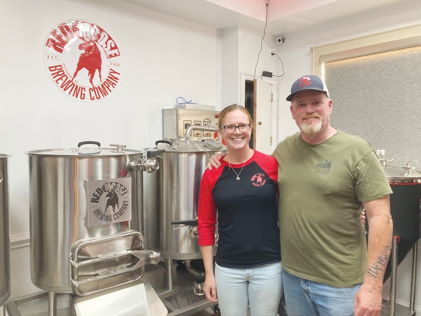 Brandi Morris and her dad, Danny Jenkins Jr., stand in the Red Moose Brewing Company's brew room.