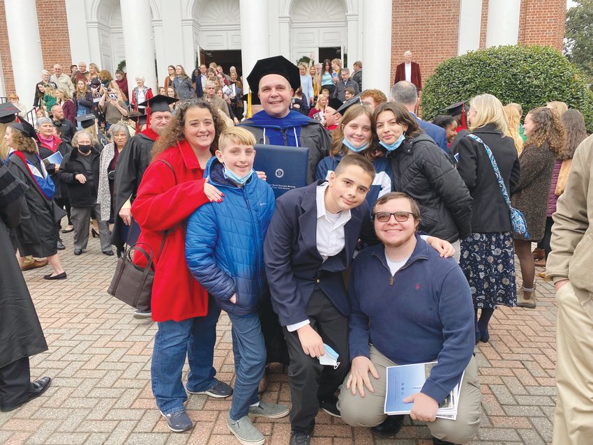 Greg Lamb pictured with his family at his Dec. 10 graduation from Southeastern Baptist Theological Seminary, where he received his Ph.D. in biblical studies. Lamb is a pastor at Mays Chapel Baptist Church in Bear Creek.