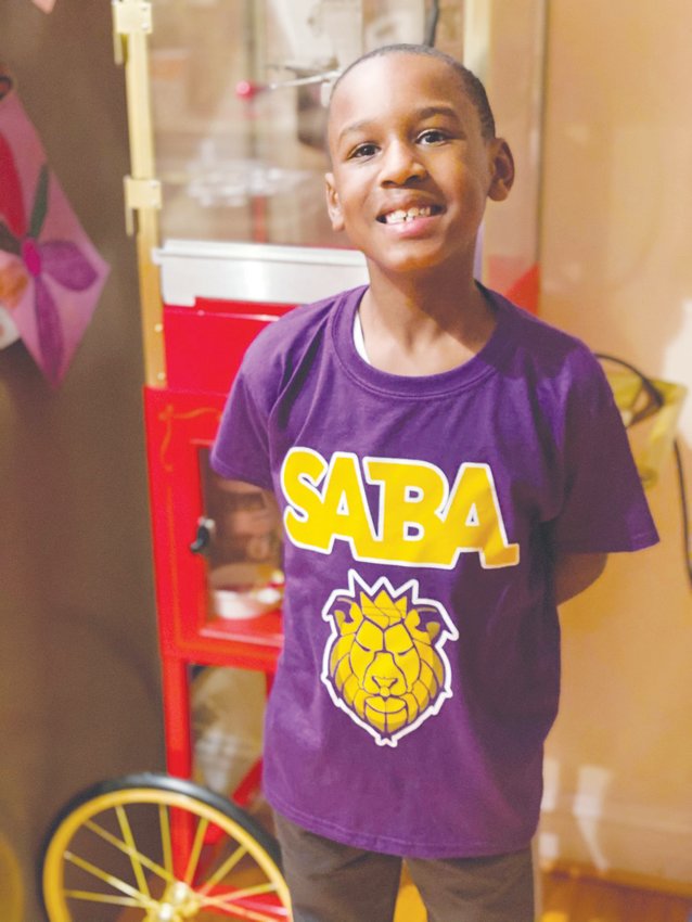 School of the Arts for Boys Academy founder Valencia Toomer&rsquo;s son, Tyson Toomer, rocking one of the school&rsquo;s new shirts last February. The school is set to open in fall 2022.