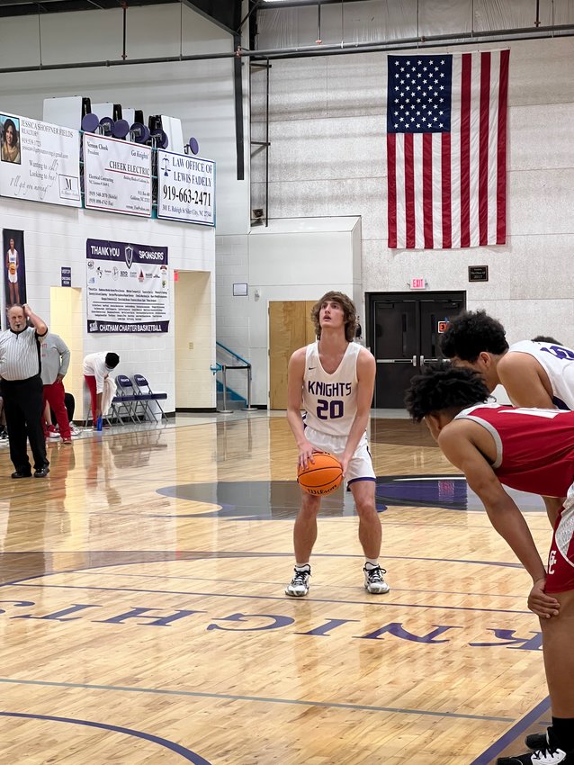 Chatham Charter junior Adam Harvey shoots a free throw in the Knights' 63-40 win over the Gates County Red Barons in the 1st round of the NCHSAA 1A tournament on Tuesday.