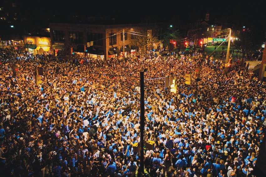 UNC fans celebrate the 94-81 men's basketball win over the Duke Blue Devils on Saturday with a timeless tradition: rushing Franklin Street. An estimated 15,000 people, including N+R photographer Peyton Sickles, were in attendance for the celebration.