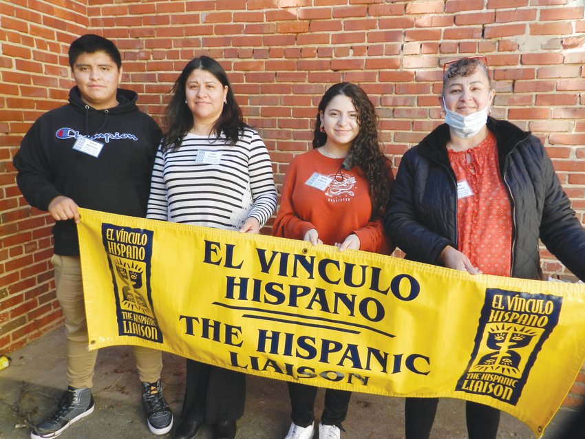 The Hispanic Liaison's COVID-19 Lay Health Advisors began knocking on doors after completing an all-day training in mid-February. From left: Ervin Martinez, Lupe Tavera, Kenia Uribe-Arraiza and Maria Herrera.