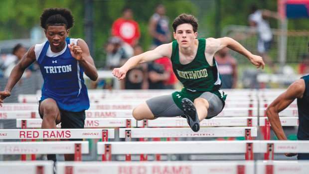 Northwood junior Ethan Wilson (in green) soars over obstacles in the men's 110-meter hurdles during the NCHSAA 3A Mideast Regionals at Franklinton High School last Saturday. Wilson took fourth place in the event, qualifying for states and prompting a shout out from his head coach, Cameron Isenhour.