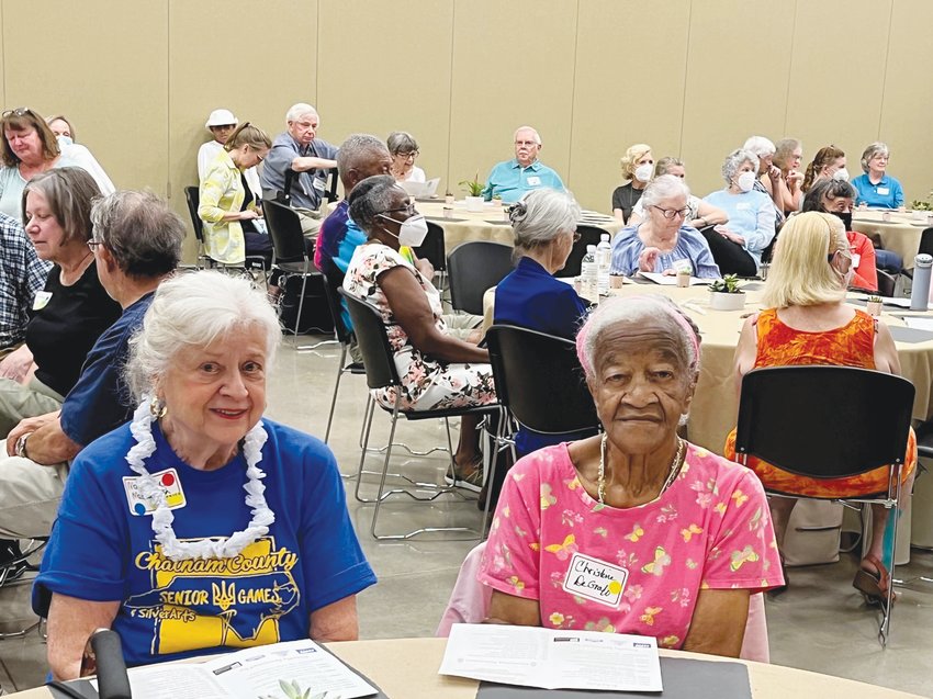 Council on Aging volunteer and board member Marylou Mackintosh, left, sits with longtime volunteer Christine Degraffenreidt during the Council&rsquo;s annual Volunteer Appreciation Luncheon last Wednesday at the Chatham County Agriculture &amp; Conference Center in Pittsboro.