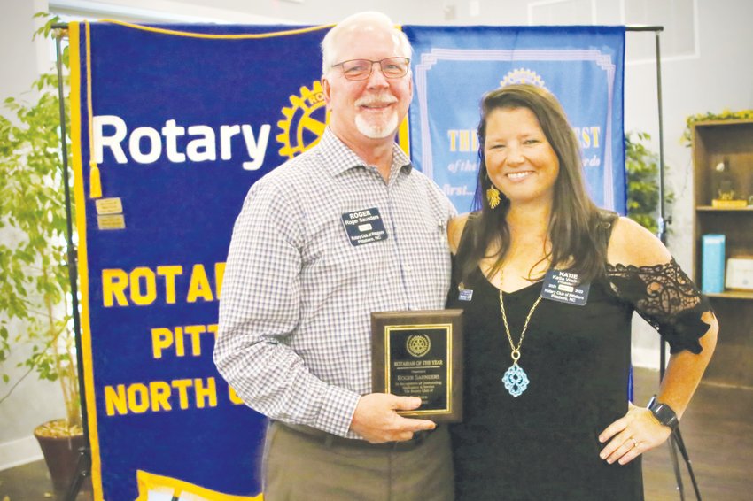 Rotarian of the Year Roger Saunders poses with Katie Walker, the outgoing President of Rotary Club of Pittsboro.