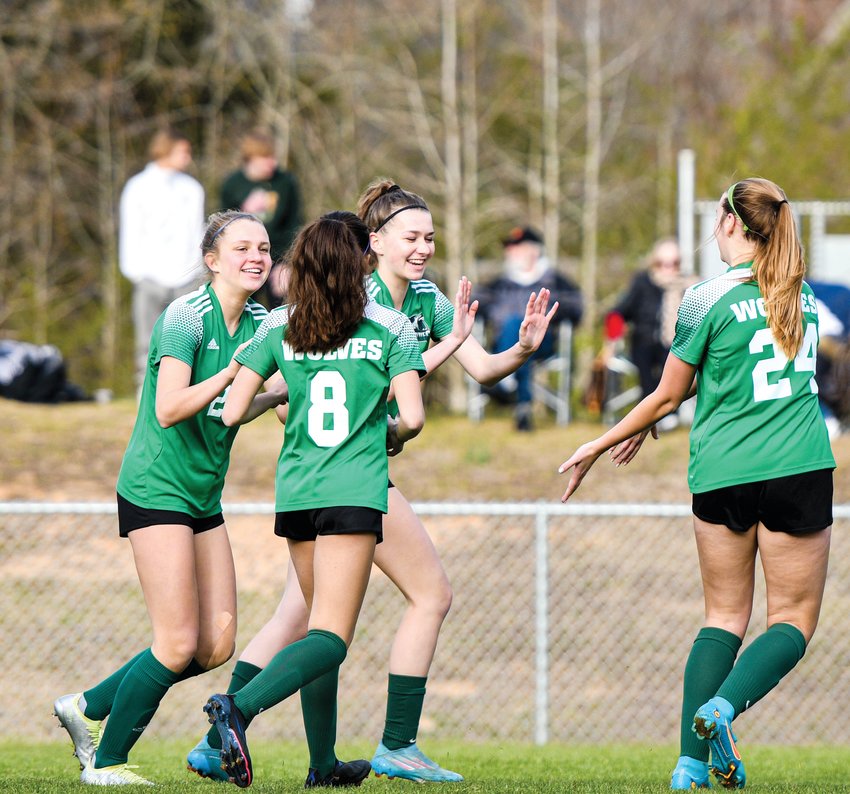 Woods Charter players celebrate after freshman Amelia Cherry (third from left) scored during the first half of a 4-0 win over Seaforth last week.
