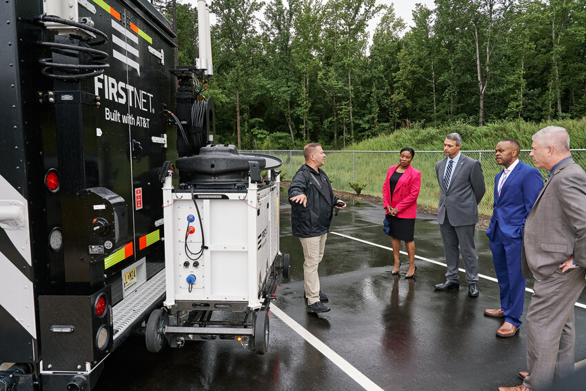 (L to R) Thomas Nicolette, Section Chief for FirstNet, shows off the First Net technology to First Net Authority Board Member, Jocelyn Moore, AT&amp;T Executive Director of External and Legislative Affairs, Robert Doreauk, NC Representative Robert Reives and NCDIT Secretary James Weaver.