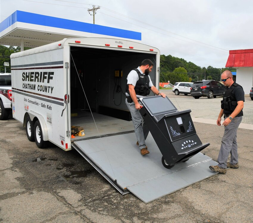 Chatham County law enforcement officers remove illegal gambling equipment.