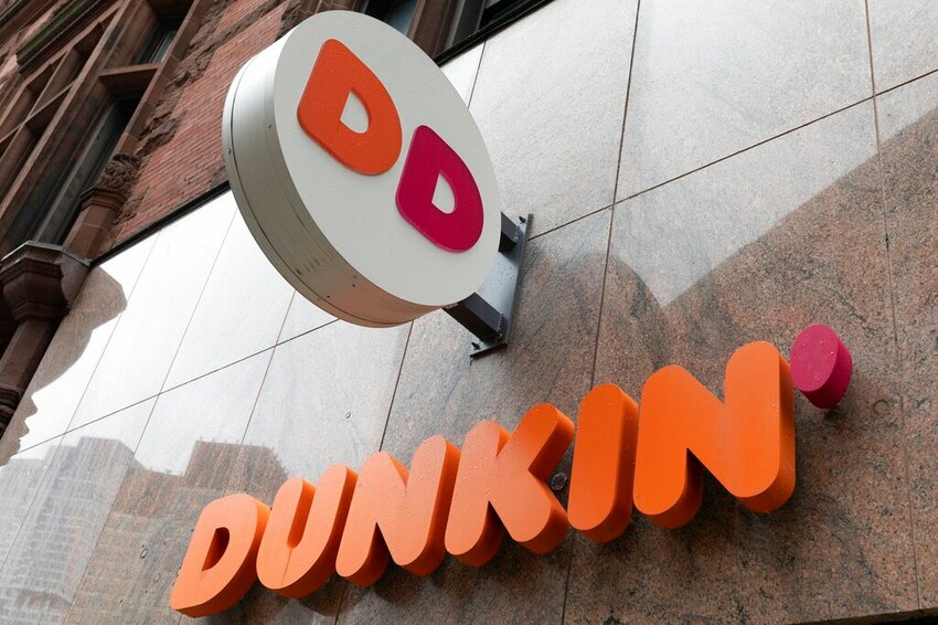 The Dunkin' Donuts logo is seen on a storefront. (AP Photo/Michael Dwyer)