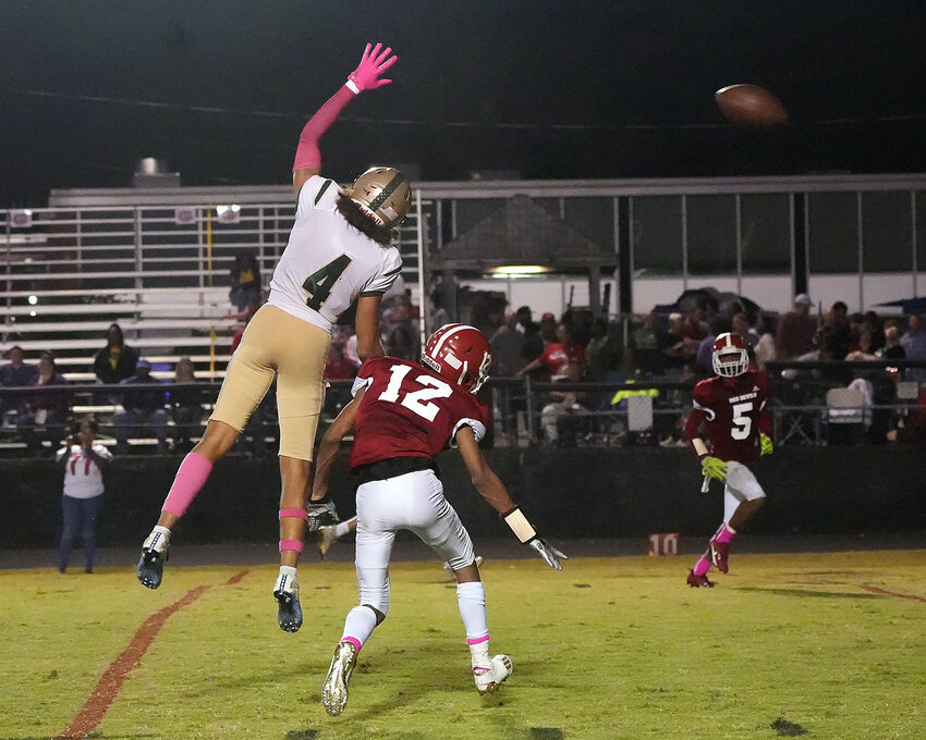 Cutline Isaiah Blair (4) leaps in an attempt to make a catch during Northwood&rsquo;s 70-12 win over Graham. The junior had a 20-yard touchdown reception in the win.
