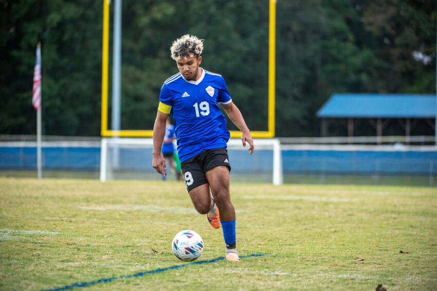 Jordan-Matthews' Francisco Ibarra looks for an open teammate against North Moore during a 1A/2A Mid-Carolina Conference match at Jordan-Matthews in Siler City, NC on October 9, 2023.