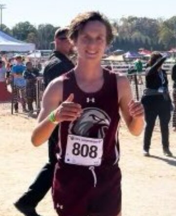 Jack Anstrom is all smiles after defending his state cross-country title.