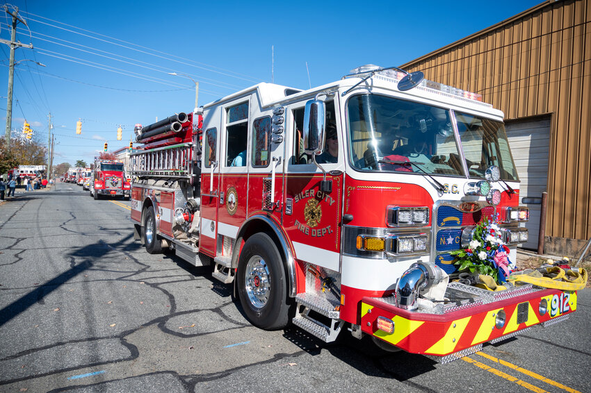 Fire apparatus and personnel from numerous local communities help celebrate the 100th Anniversary of the Siler City Fire Department. SCFD Engine 912 leads the procession in Siler City on November 18, 2023.