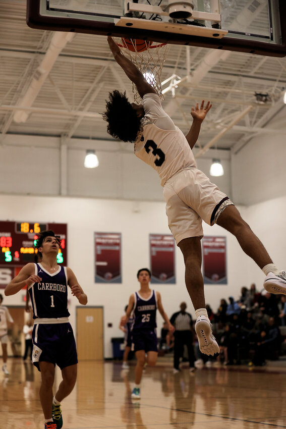 Noah Lewis dunks for two of his team-high 18 in Seaforth&rsquo;s win over Carrboro.
