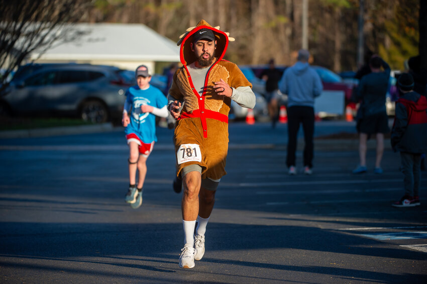 A man runs during the 19th annual Reindeer 5k at Central Carolina Community College in Pittsboro, NC on December 9, 2023.  PJ WARD-BROWN/NORTH STATE JOURNAL