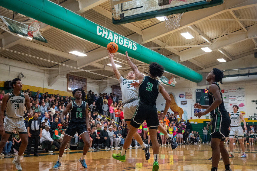 Cameron Fowler (3) puts up a shot against Myers Park during Northwood&rsquo;s loss by a score of 63-47.