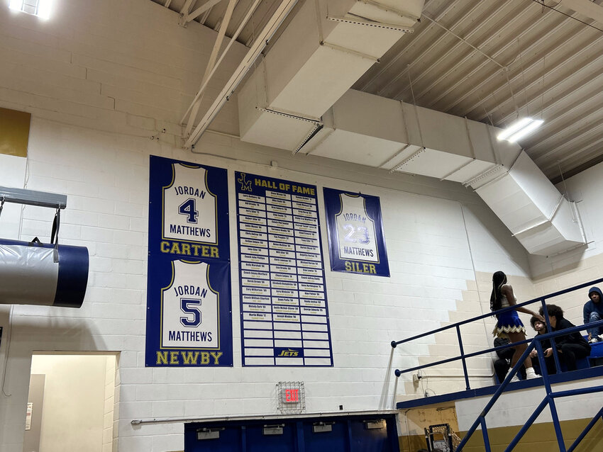 The jerseys of Terrence Newby and Reggie &ldquo;Kermit&rdquo; Carter take their place on the Jordan-Matthews gym wall, next to that of the previously retired Robert Siler&rsquo;s.