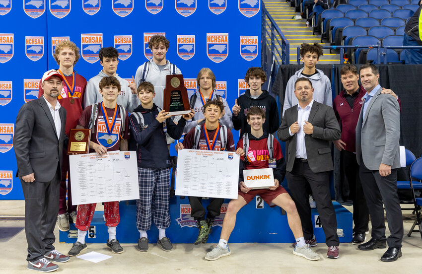The Seaforth wrestling team poses after winning the first state wrestling title in school history.