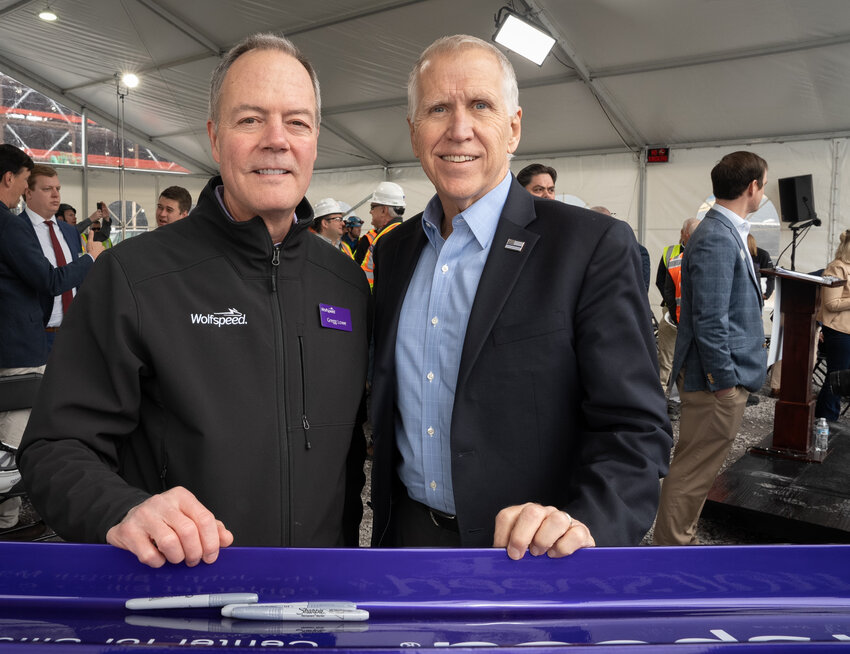 Sen. Thom Tillis (R-NC) joined Wolfspeed President and CEO Gregg Lowe in signing the ceremonial &ldquo;last beam&rdquo; at the Topping Out ceremony for The John Palmour Manufacturing Center for Silicon Carbide.