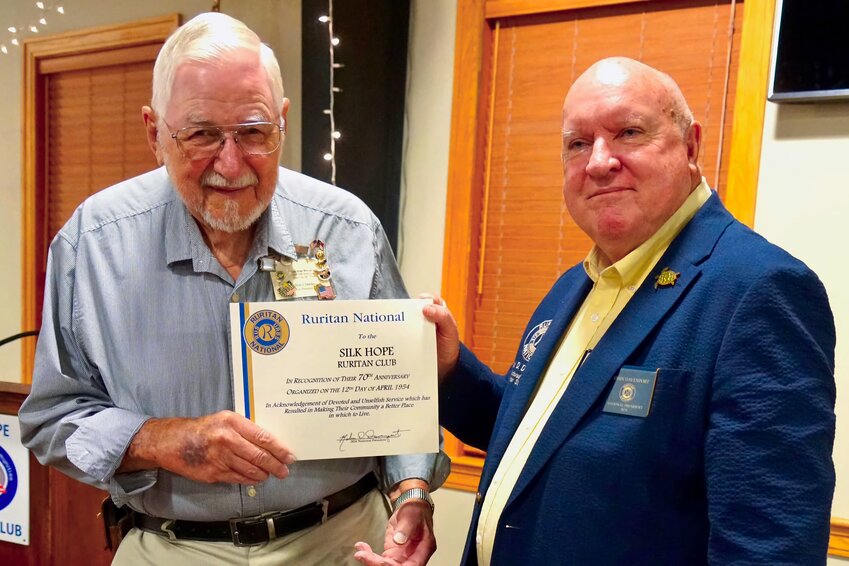 Ruritan National President Robin Davenport, right, presents Silk Hope Ruritan President Bob Crawley with a certificate celebrating the 70th anniversary of the club.