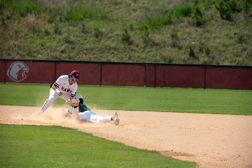 Seaforth&rsquo;s Anthony Landano tags out North Moore&rsquo;s Dalton Massey on the stolen base attempt during a Mid-Carolina conference game at Seaforth high school in Pittsboro, NC on April 20, 2024. Seaforth won 5-1 to maintain their lead in the conference.