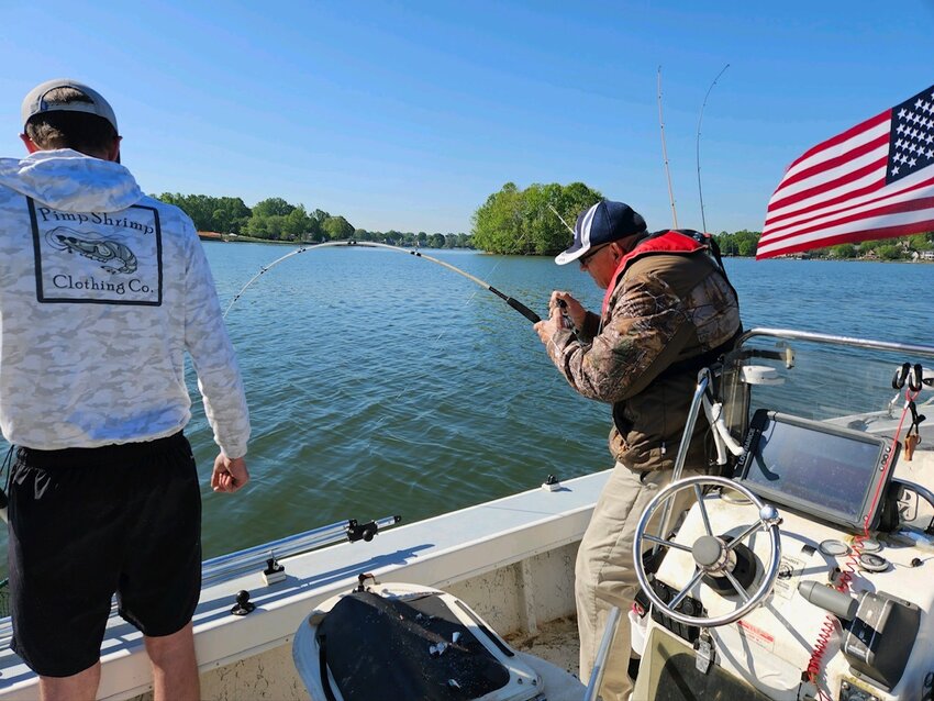 A fisherman hooks one at an Operation North State fishing festival earlier this month on Lake Norman.