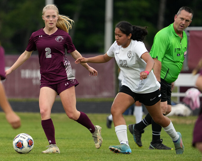 Seaforth's Caitlin Erman looks downfield as Granville Central's Carolina Rodriguez defends her. Erman scored a career-high six goals in the 12-0 win over the Panthers on May 13.