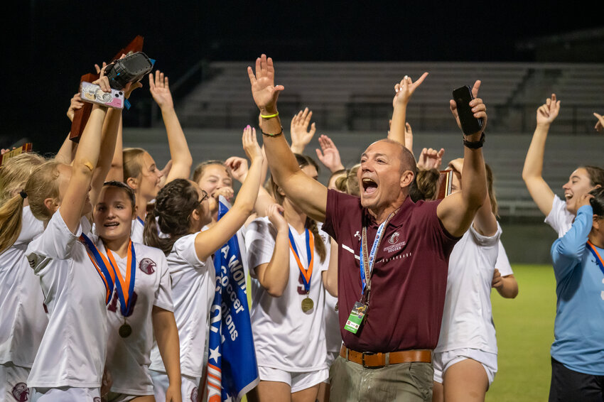 Seaforth head coach dances with his team after their win against Pine Lake Prep in the NCHSAA 2A State Championship at the Mecklenburg County SportsPlex in Matthews, NC on June 1st, 2024.