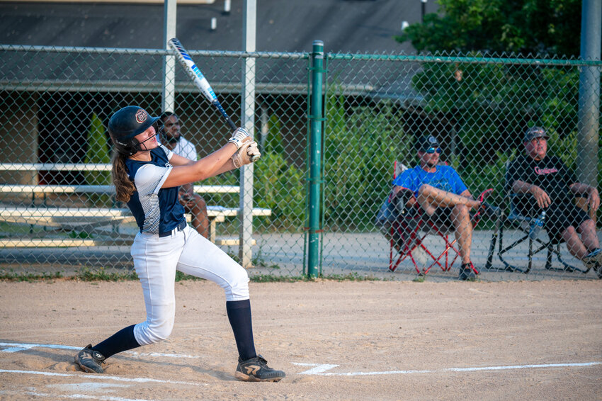 Chatham Heroes 292 Dakota Redmon hits a double driving in Emma Burke against North Wake during a division game at The Factory in Wake Forest, NC on June 26, 2024.