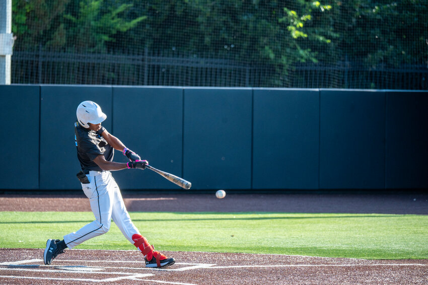 Chatham County Post 292 Janden Evans hits a single against Durham at Jack Coombs Field on the campus of Duke University in Durham, NC on June 20, 2024.
