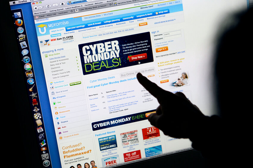 A consumer looks at Cyber Monday sales on her computer at her home in Palo Alto, Calif. (AP Photo/Paul Sakuma, File)