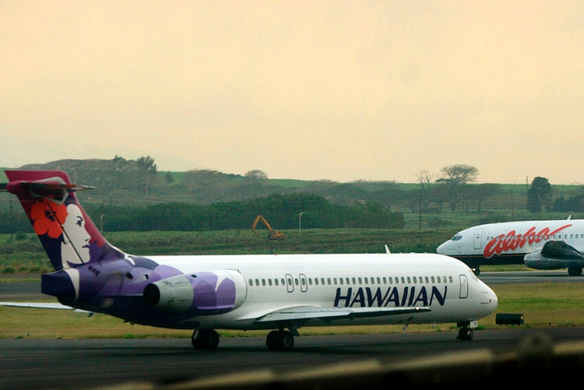 A Hawaiian Airlines plane taxis for position at Kahalui, Hawaii, on the island of Maui, March 24, 2005. (AP Photo/Lucy Pemoni, File)