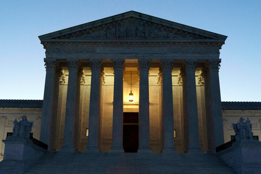 The U.S. Supreme Court is seen before sunrise on Capitol Hill in Washington, March 21, 2022. (AP Photo/Jose Luis Magana, File)
