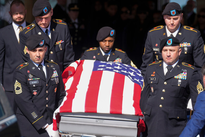 A casket holding the remains of Army Reserve soldier Staff Sgt. William Jerome Rivers is carried from a church after a funeral service Tuesday, Feb. 13, 2024, in Carrollton, Ga. Rivers was one of three Georgia soldiers killed last month in drone attack in Jordan. (AP Photo/John Bazemore)