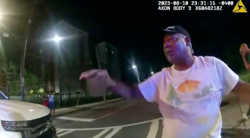 In this image take from police body camera video provided by the Atlanta Police Department, Johnny Hollman Sr. speak with Officer Kiran Kimbrough on Aug. 10, 2023 in Atlanta. (Atlanta Police Department via AP, File)