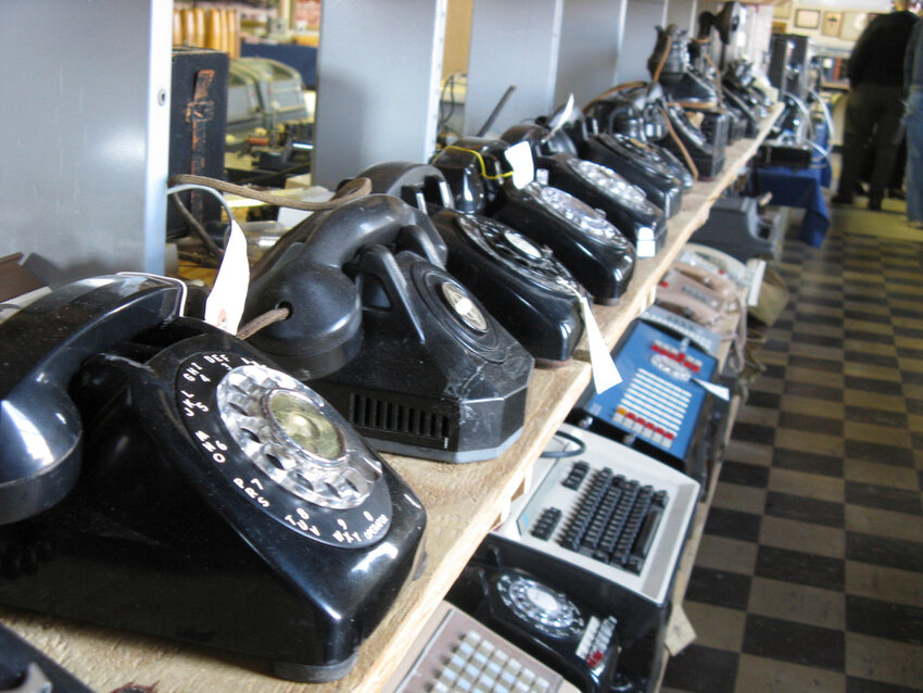 Rows of old and newer telephones along with office switchboards are displayed in a museum operated by members of the Parkersburg Council of the Telecomm Pioneers in Parkersburg, W.Va. (Jeffery Saulton/News and Sentinel via AP)