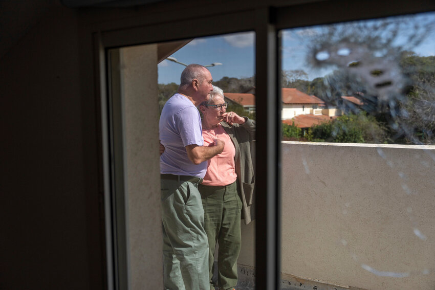 Pete and Gillian Brisley visit the home of their daughter, who was killed along with her two daughters in Hamas' Oct. 7 attack, and their son-in-law, who was taken captive, in Kibbutz Be'eri, southern Israel, Wednesday, Feb. 21, 2024. (AP Photo/Ohad Zwigenberg)