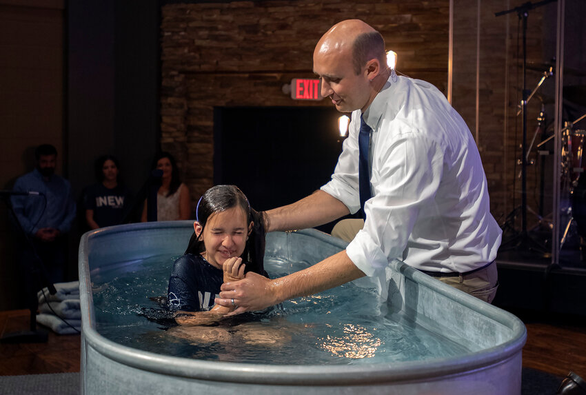 Pastor Josh Price baptizes a new believer at Fortified Hills Baptist Church in Dallas, Ga., on Sept. 3, 2023. (Index/Henry Durand)