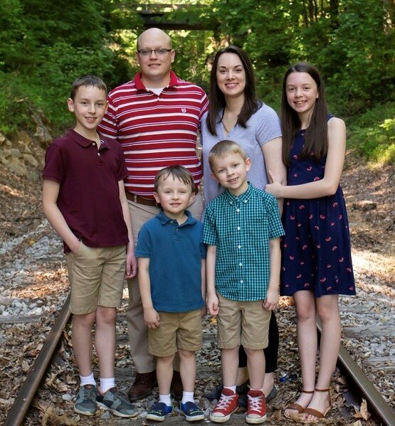 Pastor Jared Moore poses for a photo with his wife and children. Moore is expected to be nominated for president of the Southern Baptist Convention at this year's annual meeting in Indianapolis in June.