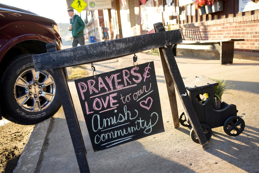 FILE - A sign on the sidewalk outside an antique store in Spartansburg, Pa., on Thursday, Feb. 29, 2024.  Shawn C. Cranston was arrested Saturday, March 2,  and charged with the slaying of a pregnant Amish woman whose body was found last week. (AP Photo/Gene J. Puskar)