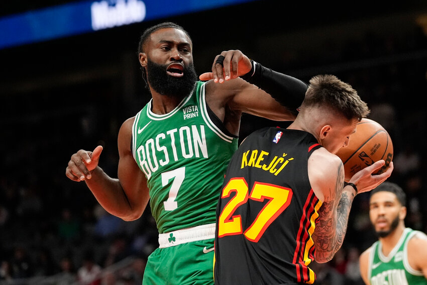 Boston Celtics guard Jaylen Brown (7) fouls Atlanta Hawks guard Vit Krejci (27) during the first half Thursday, March 28, 2024, in Atlanta. (AP Photo/John Bazemore)