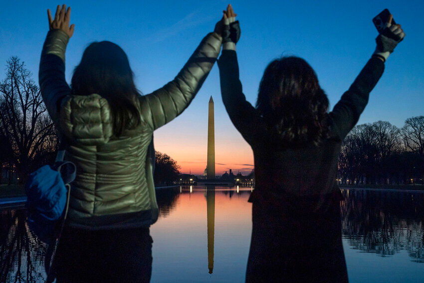 Worshippers pray on the steps of the Lincoln Memorial during a sunrise Easter service in Washington, March 31, 2024. (AP Photo/Nathan Howard, File)