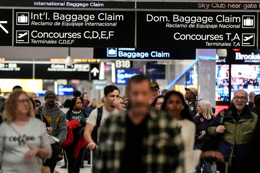 Travelers move through the B terminal at Hartsfield-Jackson Atlanta International Airport, Jan. 27, 2024, in Atlanta. (AP Photo/Mike Stewart, File)