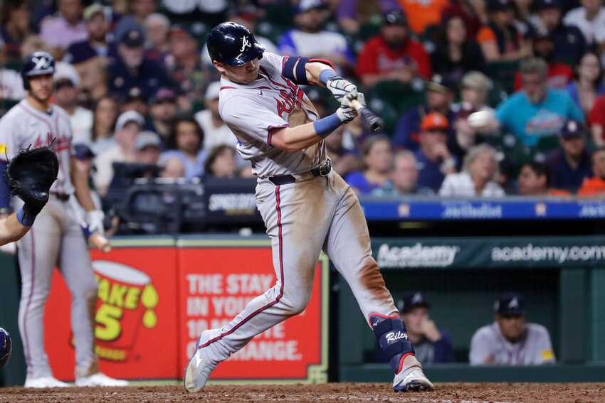 Atlanta Braves's Austin Riley hits an RBI single against the Houston Astros during the ninth inning Monday, April 15, 2024, in Houston. (AP Photo/Michael Wyke)